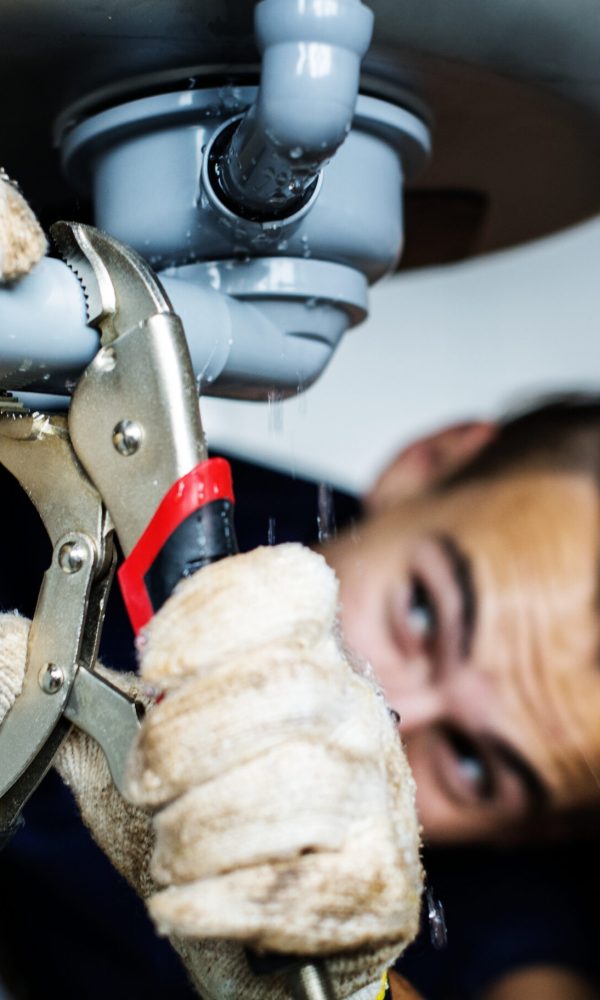 Man fixing kitchen sink